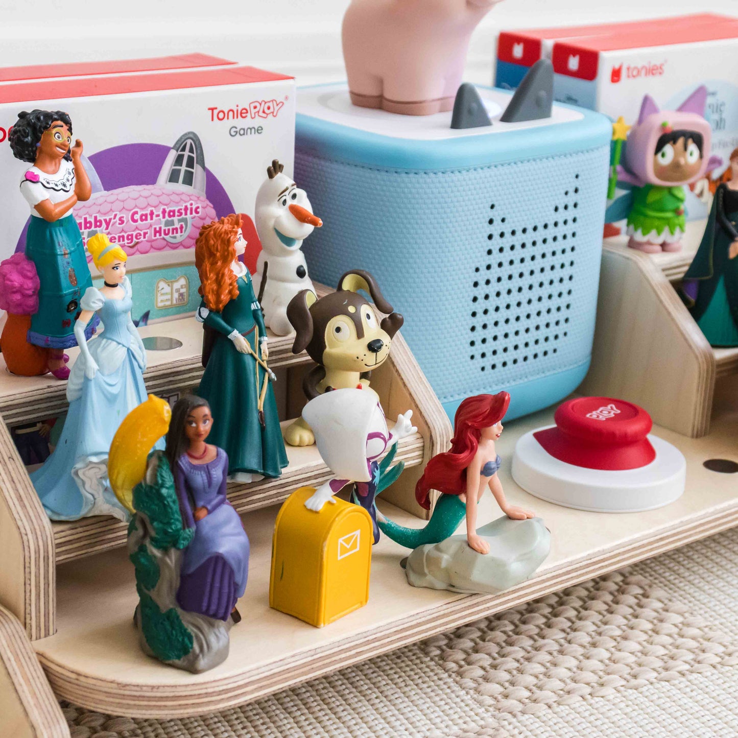 Tonies displayed on a wooden storage shelf designed to hold the magnetic tonies.