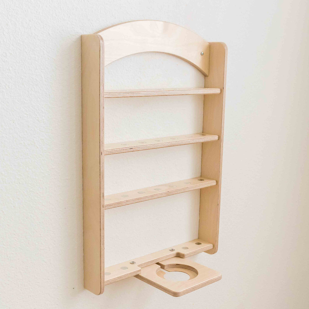 Side view of a wall mounted shelf made to display a tonie box set.