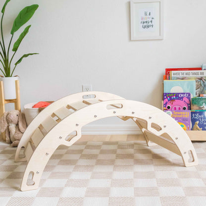 Wooden arch toy in a child's room with books and a plant.