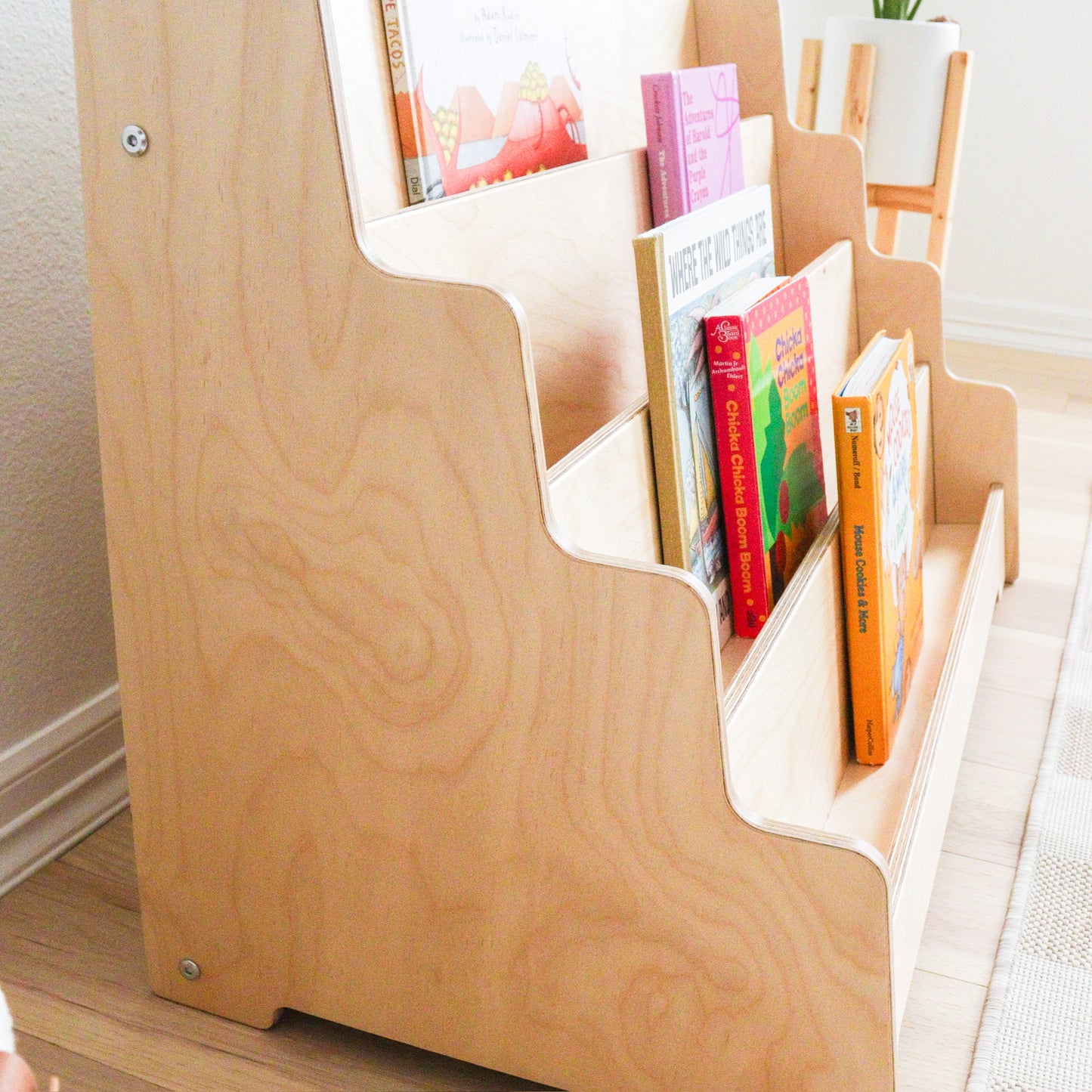 Side view of wooden kids bookshelf. 
