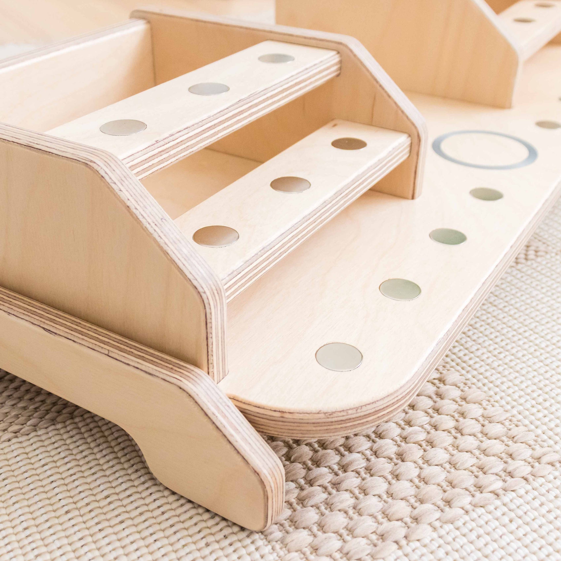 Metal dots on a storage display designed to hold tonie figures. 