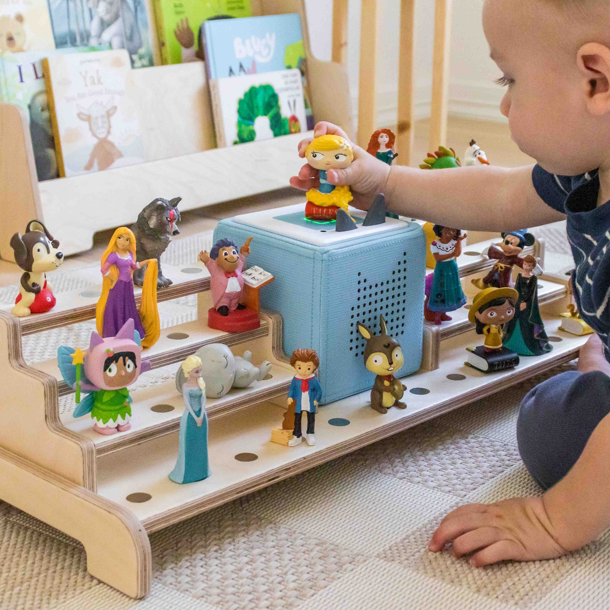 Child playing with Tonie display. 