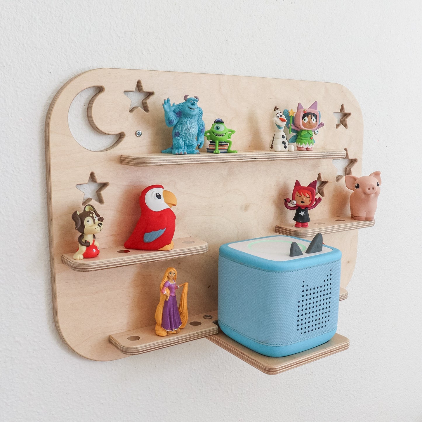 toniebox 2 shelf holding a blue toniebox and several diferent tonie characters 